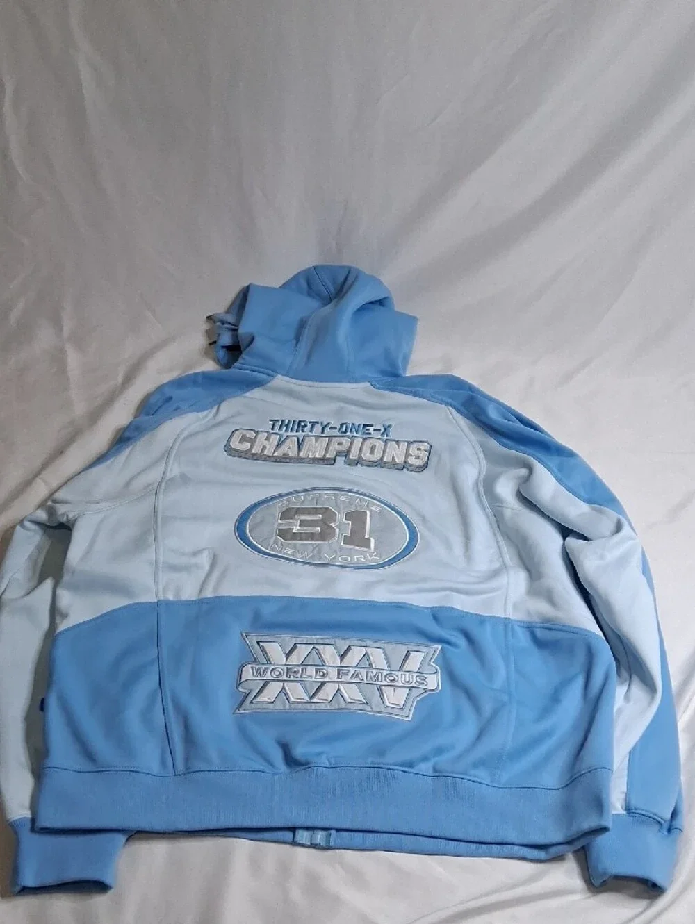 Supreme Light Blue Zip-Up Hoodie with Racing Patches